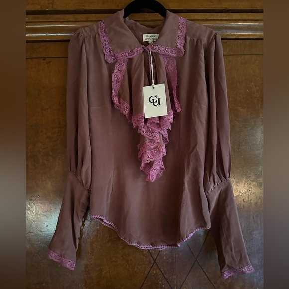 Chasing Unicorns Good Times, Bad Times Silk Crepe,
Lace + Ruffle Blouse
Mauve - Picture 4 of 5
